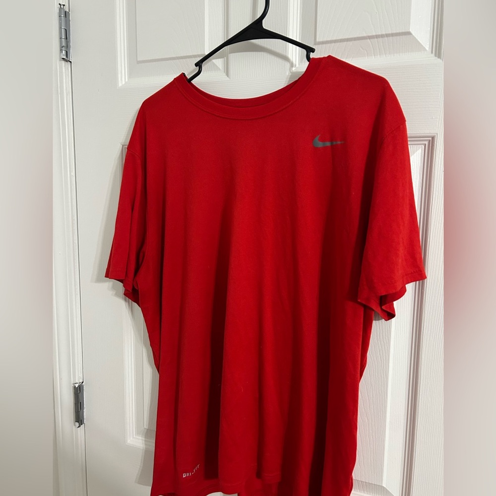Two red Nike dry fit shirts